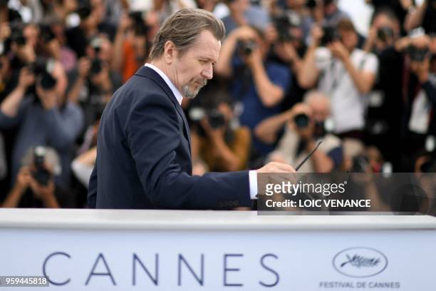 British actor Gary Oldman poses on May 17, 2018 during a "Rendez-Vous with Gary Oldman" at the 71st edition of the Cannes Film Festival in Cannes,...