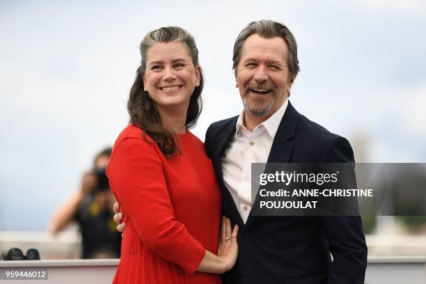 British actor Gary Oldman and his wife Gisele Schmidt pose on May 17, 2018 during a "Rendez-Vous with Gary Oldman" at the 71st edition of the Cannes...