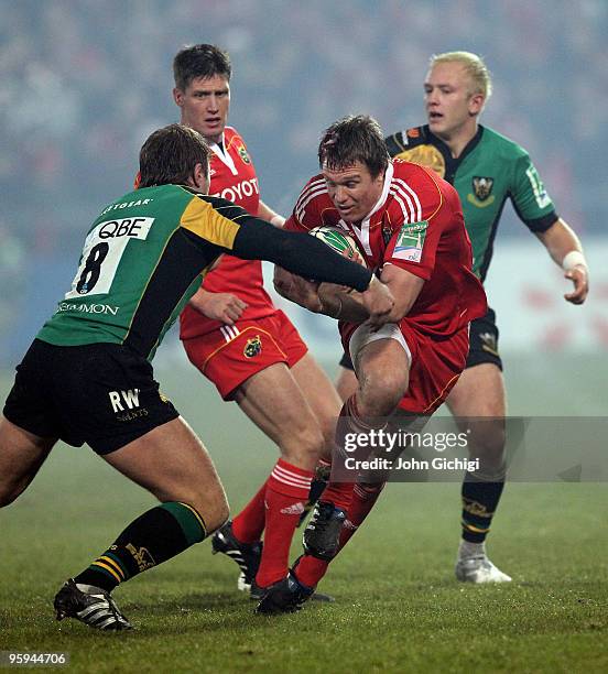 Jean De Villiers of Munster breaks through during the Heineken Cup game between Munster and Northampton Saints at Thomond Park on January 22, 2010 in...