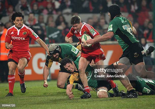 Ronan O'Gara of Munster breaks through during the Heineken Cup game between Munster and Northampton Saints at Thomond Park on January 22, 2010 in...
