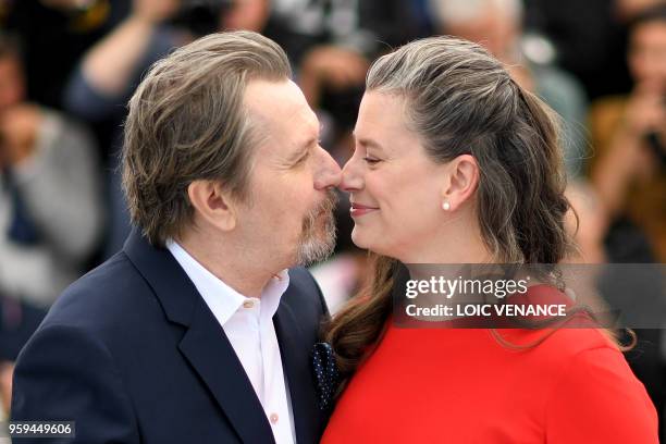 British actor Gary Oldman poses with his wife Gisele Schmidt on May 17, 2018 during a "Rendez-Vous with Gary Oldman" at the 71st edition of the...