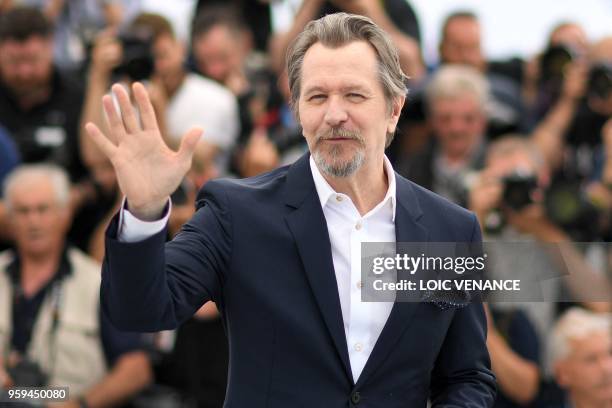 British actor Gary Oldman waves on May 17, 2018 during a "Rendez-Vous with Gary Oldman" at the 71st edition of the Cannes Film Festival in Cannes,...