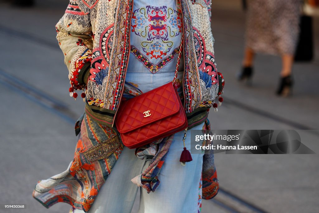 A guest wearing jacquard jacket and Chanel clutch during... News Photo ...