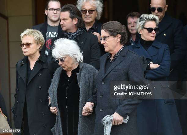 French humorist Muriel Robin, and French singers Catherine Lara and Francis Cabrel leave the funeral ceremony of late Belgian singer Maurane at the...