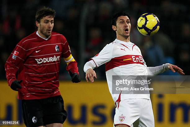 Ciprian Marica of Stuttgart controles the ball ahead of Heiko Butscher of Freiburg during the Bundesliga match between SC Freiburg and VfB Stuttgart...