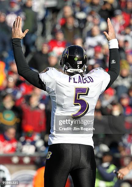 Joe Flacco of the Baltimore Ravens reacts after the Ravens scored a touchdown against the New England Patriots during the 2010 AFC wild-card playoff...