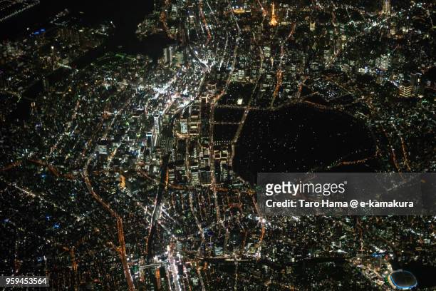 center of tokyo in japan night time aerial view from airplane - airport aerial view photos et images de collection