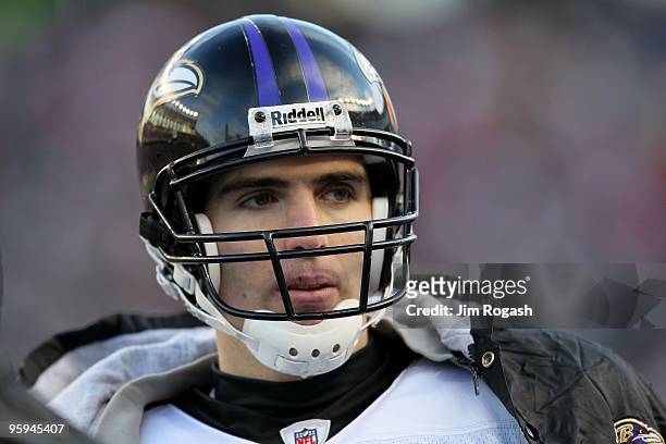 Quarterback Joe Flacco of the Baltimore Ravens looks on from the sideline against the New England Patriots during the 2010 AFC wild-card playoff game...