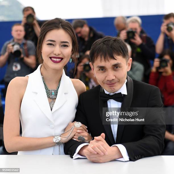 Actress Dinara Baktybaeva and director Adilkhan Yerzhanov attends "The Gentle Indifference Of The Word" Photocall during the 71st annual Cannes Film...