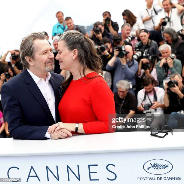 Actor Gary Oldman kisses wife Gisele Schmidt at the Rendez-Vous with Gary Oldman Photocall during the 71st annual Cannes Film Festival at Palais des...