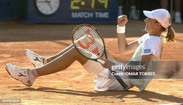 Katarina Srebotnik of Slovenia, sits on the court celebrating he victory against Argentinain Paola Suarez, during the finals at the ATP tennis match...