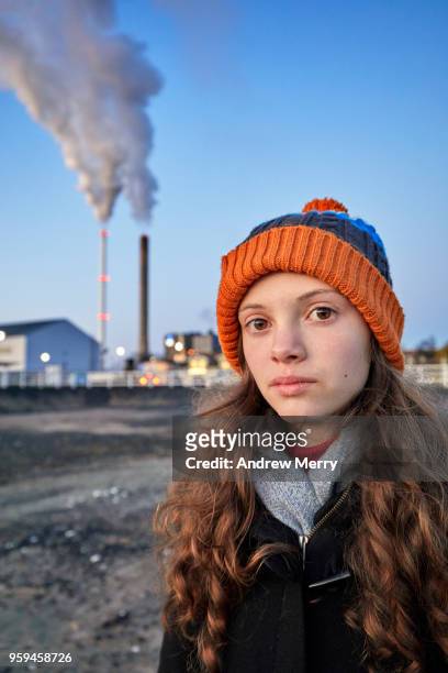 girl standing near apartment block and power station smoke stacks, oulu, finland - 15 years girl bare stock pictures, royalty-free photos & images