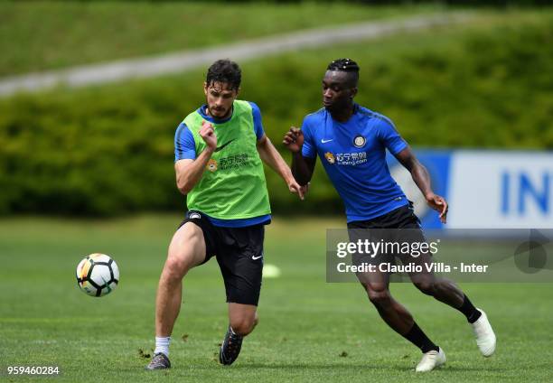 Andrea Ranocchia and Yann Karamoh of FC Internazionale compete for the ball during the FC Internazionale training session at the club's training...