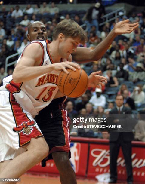 Atlanta Hawks Hanno Mottola drives by Miami Heats Eddie Laphonso Ellis at Philips Arena 03 November 2001 in Atlanta. The Hawks beat the Heat 90-83....