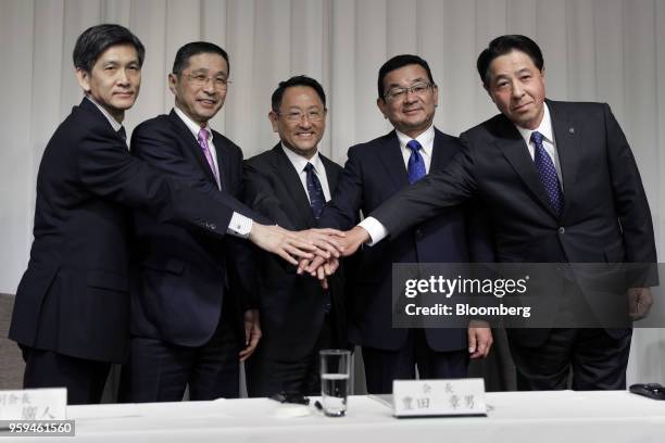 From left to right, Seiichi Nagatsuka, president and vice chairman of Japan Automobile Manufacturers Association Inc. , Hiroto Saikawa, president and...