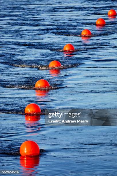 red buoy line, floating barrier in river - length stock pictures, royalty-free photos & images
