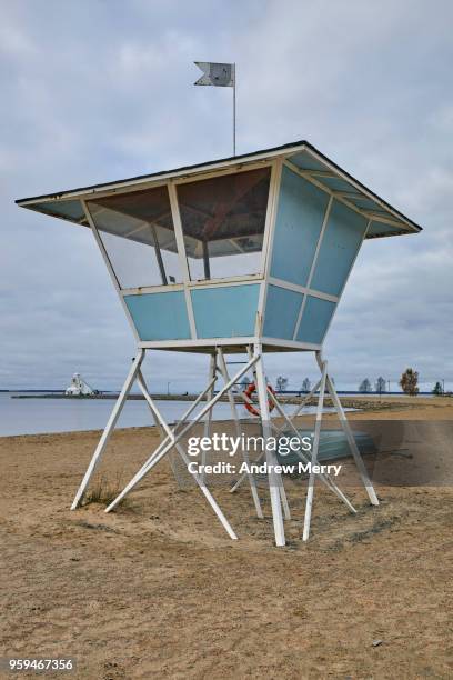 empty beach with lifeguard hut or tower on stilts, nallikari beach, oulu, finland - styltor bildbanksfoton och bilder