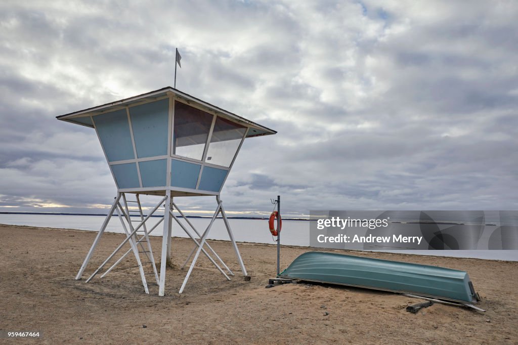 Empty beach with lifeguard hut or tower on stilts, Nallikari Beach, Oulu, Finland