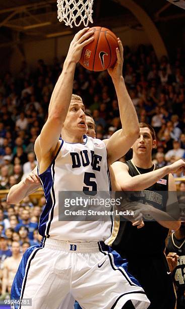 Mason Plumlee of the Duke Blue Devils rebounds the ball during the game against the Wake Forest Demon Deacons on January 17, 2010 in Durham, North...