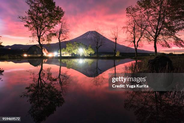 mt. fuji and a dramatic sky reflected in a pond - yuga kurita stock pictures, royalty-free photos & images