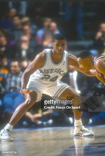 Jim Jackson of the Dallas Mavericks closely guards John Starks of the New York Knicks during an NBA basketball game circa 1993 at Reunion Arena in...
