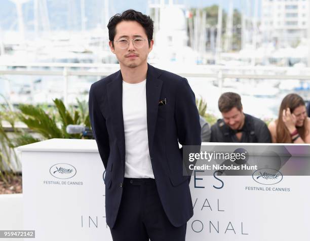 Steven Yeun attends the "Burning" Photocall during the 71st annual Cannes Film Festival at Palais des Festivals on May 17, 2018 in Cannes, France.