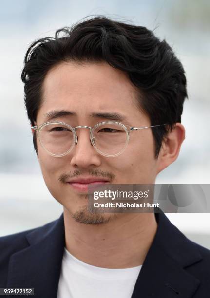 Steven Yeun attends the "Burning" Photocall during the 71st annual Cannes Film Festival at Palais des Festivals on May 17, 2018 in Cannes, France.