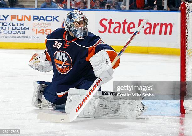 Goaltender Rick DiPietro of the New York Islanders guards the net against the New Jersey Devils on January 18, 2010 at Nassau Coliseum in Uniondale,...