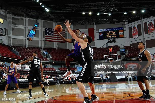 Curtis Stinson of the Iowa Energy goes up for a shot over Dwayne Jones of the Austin Toros in the 2010 D-League Showcase at Qwest Arena on January 5,...