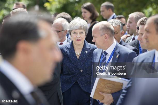 Theresa May, U.K. Prime minister, center, departs with other European Union and Balkan leaders following a family photo at a summit of EU leaders in...