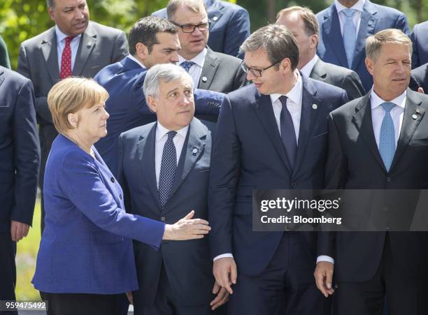 Angela Merkel, Germany's chancellor, left, speaks to Aleksandar Vucic, Serbia's president, second right, as Antonio Tajani, European Parliament...