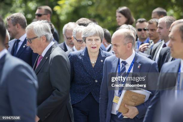 Theresa May, U.K. Prime minister, center, departs with other European Union and Balkan leaders following a family photo at the summit of EU leaders...