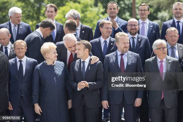 Edi Rama, Albania's prime minister, second row center left, speaks with Emmanuel Macron, France's president, center, as Dalia Grybauskaite,...