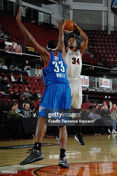 Bennet Davis of the Utah Flash shoots over DJ White of the Tulsa 66ers in the 2010 D-League Showcase at Qwest Arena on January 5, 2010 in Boise,...