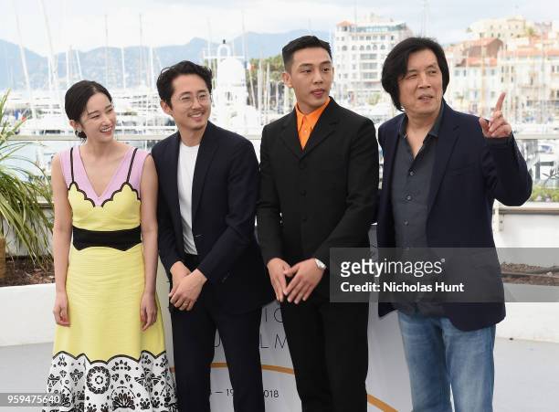 Actors Jong-seo Jeon, Steven Yeun, Ah-in Yoo and director Chang-dong Lee attend the "Burning" Photocall during the 71st annual Cannes Film Festival...