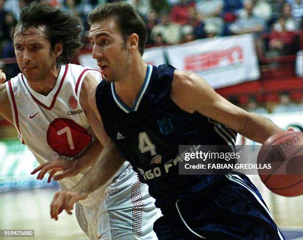 Jose Sanchez of Argentina dribbles the ball down the court while being guarded by Steve Nash of Canada during a second-round game of the Pre-World...