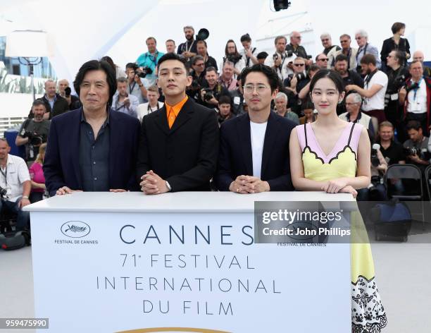 Lee Chang-Dong, Yoo Ah-in, Steven Yeun and Jun Jong Seo attend the "Burning" Photocall during the 71st annual Cannes Film Festival at Palais des...