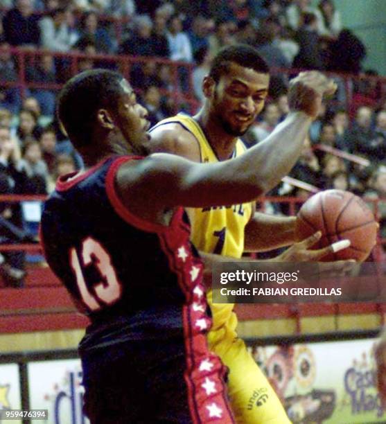 Jose of Brazil tries to get around J.K. Edwards of the US during a game in the Ruca-Che Stadium in Neuquen, Argentina on August 16, 2001. Jose , de...