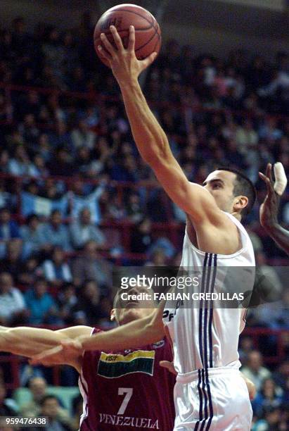 Emanuel Ginobili of Argentina, guarded by Richard Lugo of Venezuela, looks for the net during a game in the Ruca-Che Stadium in Neuquen, Argentina on...