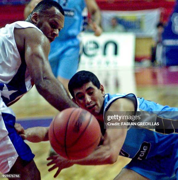 Marcelo Capalbo of Uruguay fights for the ball with Jerome Moncy of Puerto Rico during a game in the Ruca-Che Stadium in Neuquen, Argentina on August...