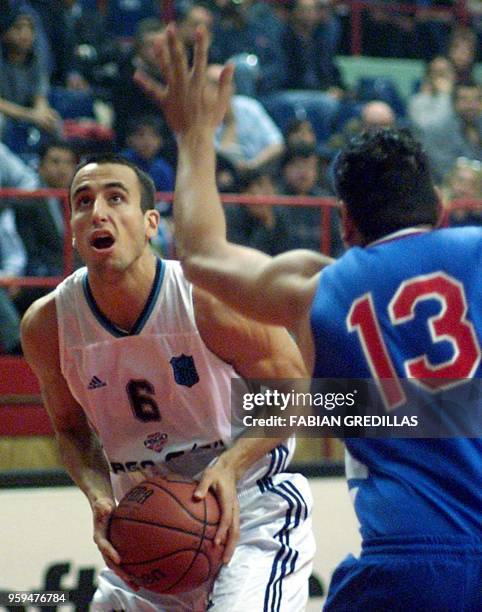 Emanuel Ginobili of Argentina prepares to shoot the ball while being guarded by Antonio Garcia of Panama during the second round of the Pre-Wold...