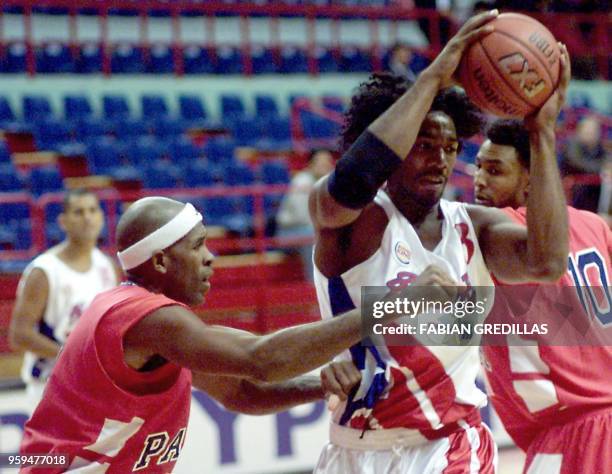 Sharif Fajardo of Puerto Rico evades Leroy Jackson of Panama during a game in the Ruca-Che Stadium in Neuquen, Argentina on August 16, 2001. Sharif...