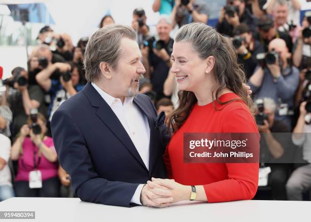 British actor Gary Oldman poses with his wife Gisele Schmidt at the Rendez-Vous with Gary Oldman Photocall during the 71st annual Cannes Film...