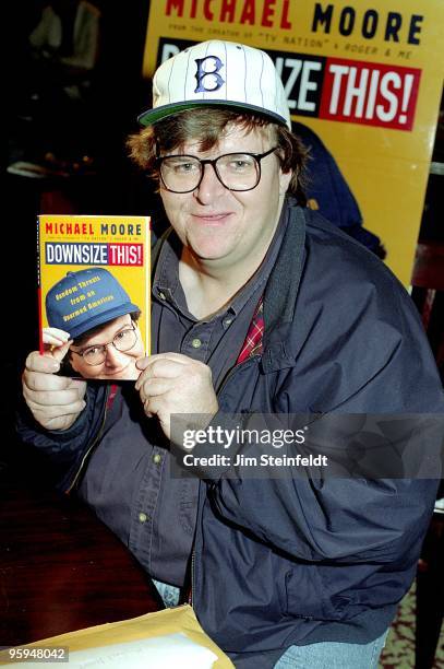 Movie director Michael Moore poses for a portrait with his book "Downsize This!" at Book Soup bookstore in Los Angeles, California in 1997.