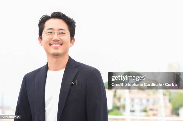 Steven Yeun attends "Burning" Photocall during the 71st annual Cannes Film Festival at Palais des Festivals on May 17, 2018 in Cannes, France.