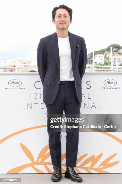 Steven Yeun attends "Burning" Photocall during the 71st annual Cannes Film Festival at Palais des Festivals on May 17, 2018 in Cannes, France.