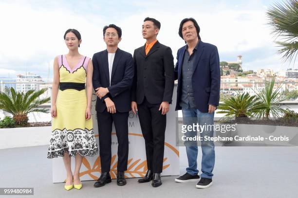 Jong-seo Jeon, Steven Yeun, Ah-in Yoo and director Chang-dong Lee attend "Burning" Photocall during the 71st annual Cannes Film Festival at Palais...