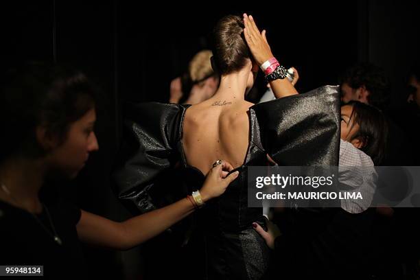 Model receives the final touches before the start of the Andre Lima fashion show, as part of the 2010-2011 Fall-Winter collections of the Sao Paulo...