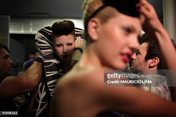 Models get ready for the Andre Lima fashion show, as part of the 2010-2011 Fall-Winter collections of the Sao Paulo Fashion Week, in Sao Paulo,...