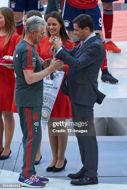 Head coach Jupp Heynckes of Muenchen receives his medal and champion pennant from DFL managing Director Christian Seifert after the Bundesliga match...